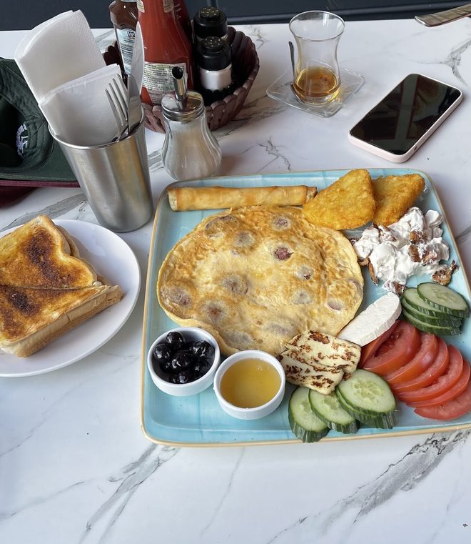 A Turkish breakfast tray on a marble table